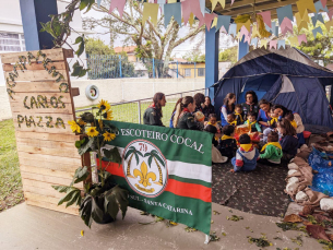 Notícia - Escoteiros de Cocal do Sul realizam momento musical com crianças do CEI Afasc Carlos Piazza